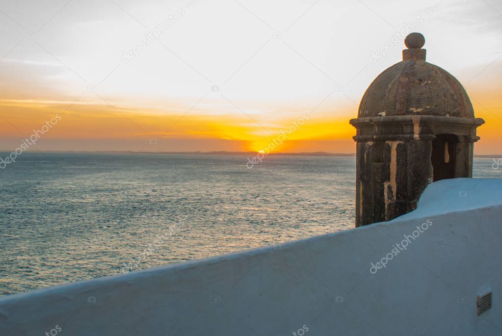 Beautiful sunset on the sea. Panoramic view of Barra Lighthouse in Salvador, Bahia, Brazil