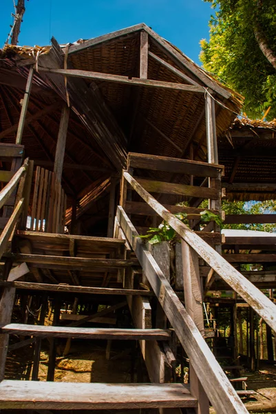 Amazon river, Manaus, Amazonas, Brazil: Wooden bridge and houses. Lodge for tourists on the island on the Amazon river.