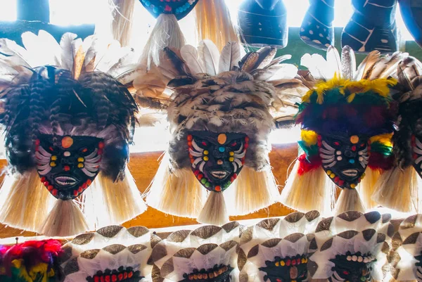 Mask .Souvenirs in the Amazon rainforest made from local nuts and animals near Iquitos. Market for tourists on the Amazon river. Amazonas, Brazil — Stock Photo, Image