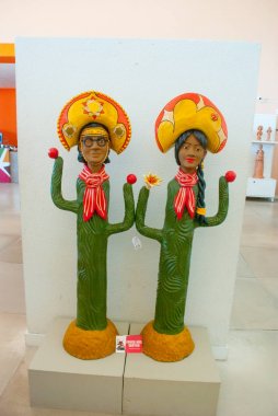 Recife, BRAZIL: clay sculptures painted with vibrant colors and used as home decoration in the Northeast of Brazil in Olinda and Recife, Pernambuco, Brazil. clipart
