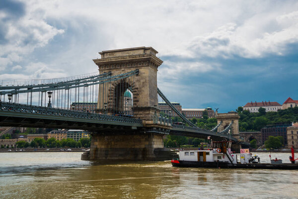 Magnificent Chain Bridge in beautiful Budapest. Szechenyi Lanchid is a suspension bridge that spans the River Danube between Buda and Pest, in the capital of Hungary. Europe