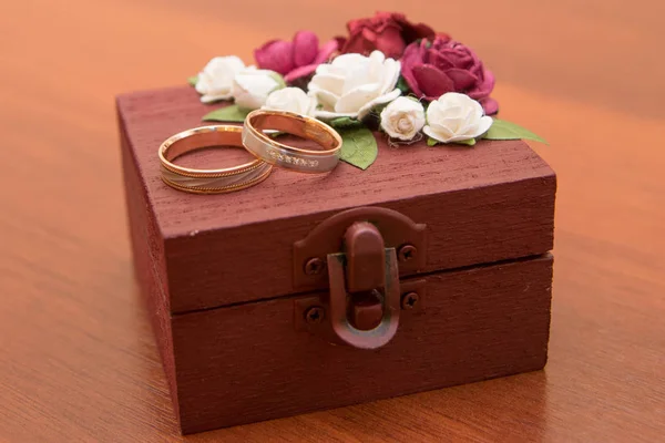 Wooden box for wedding rings of the bride and groom.