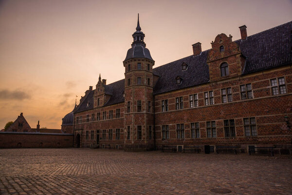 Hillerod, Denmark, Frederiksborg Castle: One of the recognized masterpieces of the Scandinavian Renaissance. Evening landscape with castle in autumn