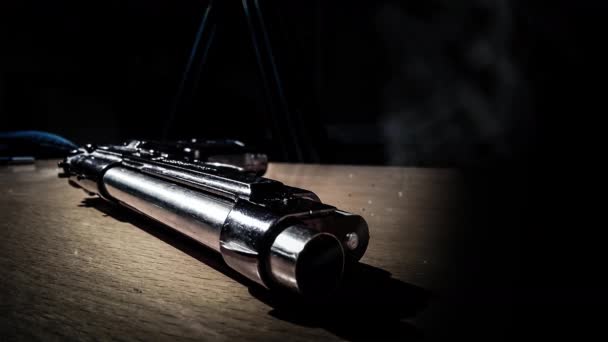 Cinemagraph Smoke Emitted Canrel Silver 9Mm Pistol Lying Wooden Table — Vídeos de Stock