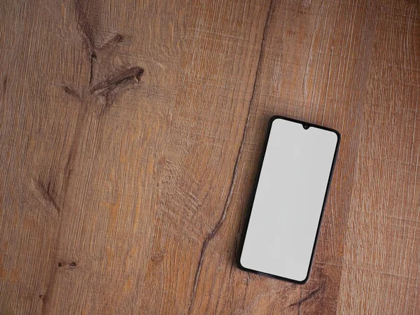 Auf Der Oberfläche Liegt Eine Schwarze Smartphone Attrappe Mit Leerem — Stockfoto