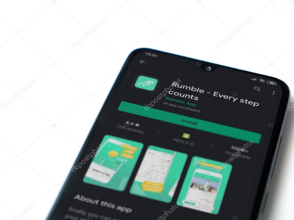 Lod, Israel - July 8, 2020: Rumble app play store page on the display of a black mobile smartphone isolated on white background. Top view flat lay with copy space.