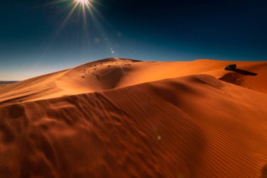 Across the desert in a 4x4 vehicle.Dunes of Erg Chebbi, Sahara Desert, Morocco clipart