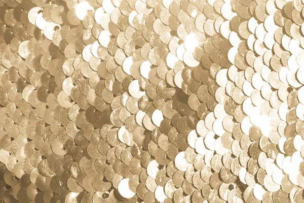 background of gold sequins. shiny sparkling background