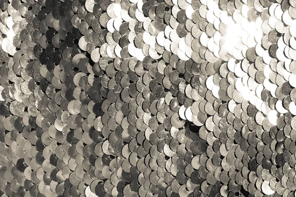 background of silver sequins. shiny sparkling background