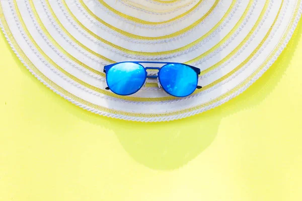 Travel vacation background. Sun glasses yellow background. Concept summer holidays.
