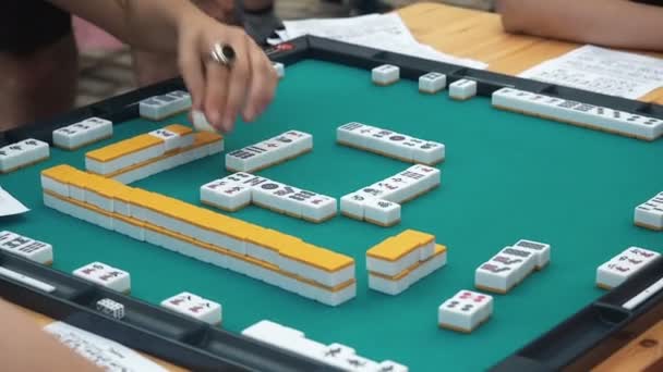 People Playing Mahjong Asian Tile-based Game. Table Gambling — Stock Video