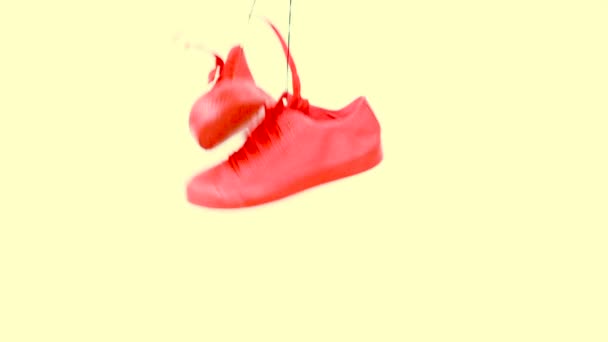 Hanging Bright Colored Sneakers Fall Down and Hang. Fashion Woman Trendy Trainers. Stylish Hipster Plimsole Bright Yellow Coral Color Sneakers. Minimal Pop Art Concept . Psychedelic Flat Lay. Art — Stock Video