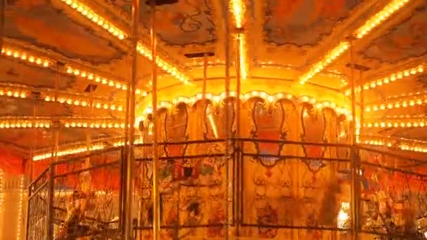 Beautiful brightly glowing carousel on the Red Square decorated and arranged for Christmas and New Year. Christmas fairy illuminated turnabout . Luminous roundabout rotates. Wonderful magic xmas — Stock Video