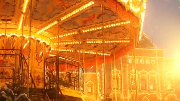 Beautiful brightly glowing carousel on the Red Square decorated and arranged for Christmas and New Year. Christmas fairy illuminated turnabout . Luminous roundabout rotates. Wonderful magic xmas — Stock Video