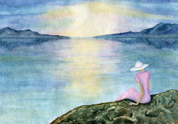 Bir kadın deniz üzerine oturuyor