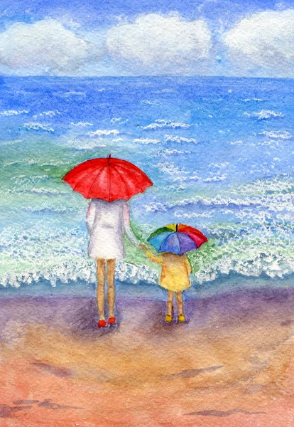 Deniz kenarında bir çocukla kadın