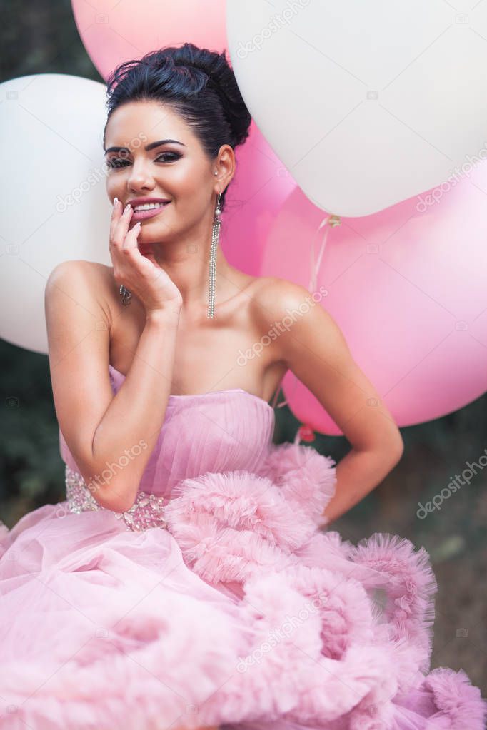 Happy Valentines day, portrait of fashion sexy woman dressed in pink stunning dress