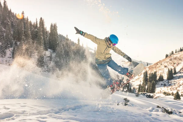 Snowboarder doing his trick method with nose grab — Stock Photo, Image