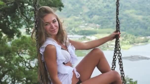 Sexy woman with health skin at swing wearing white swimsuit — Stock Video