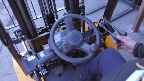 Closeup Man drives a reliable heavy truck forklift loader — Stock Video