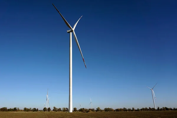Eco power, wind turbines with blue sky. wind turbine for alternative electricity.renewable electric farm with sustainable eco-friendly technology using wind energy rotation for wind turbines renewable