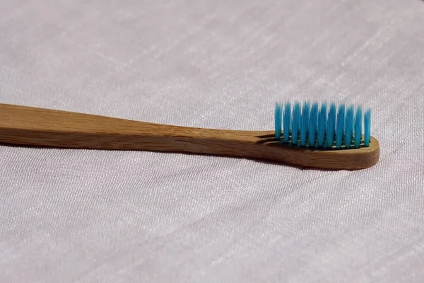 Close Eco Friendly Blue Bamboo Toothbrush White Linen Background Natural — Stock Photo, Image