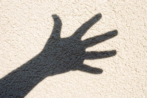 Schaduw Van Een Hand Een Lichte Muur Freehand Shadow — Stockfoto