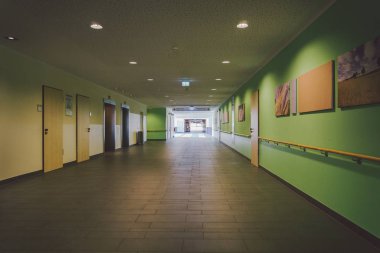 October 2018. Germany Helios Klinikum Krefeld. Interior hospital inside. Spacious deserted corridors of station, floor of new hospital, German European medicine. Theme of health care clinic interior. clipart