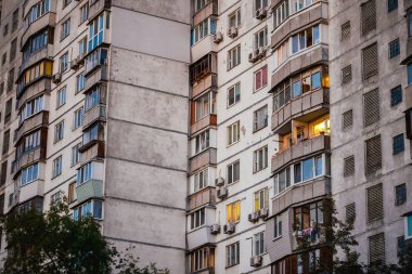 Ghetto architecture the collapse of the Soviet Union. Echo of the USSR. Country high-rise houses in the evening in Obolon district in the city of Kiev Ukraine. clipart