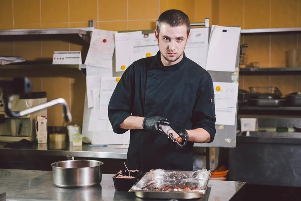 Theme Cooking Young Caucasian Man Black Uniform Latex Gloves Restaurant — Stock Photo, Image