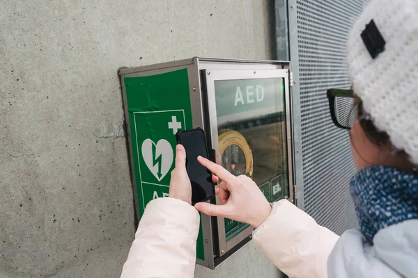 medicine cardiopulmonary resuscitation emergency call. Caucasian woman uses telephone calling 911 help. device box aed automatic defibrillator diseases, clinical death, cardiac arrest and heart attack