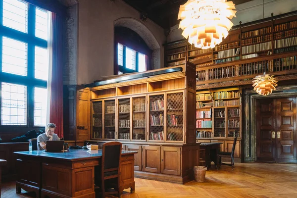 Storage of books. Large old library in the Gothic style. Shelves and rows with books. City Library at the City Hall of Denmark Copenhagen 18 February 2019 — Stock Photo, Image