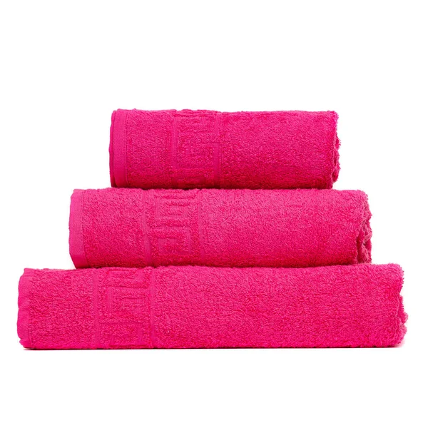 3 frotte towels crimson color, bedroom towel white backgroung. Colorful crimson bath towels isolated. Stack crimson towels. Pile colored towels isolate. Three cotton towel of same color stacked.