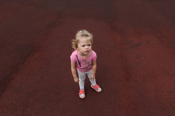 Capricious Little Girl Dark Red Background — Stock Photo, Image