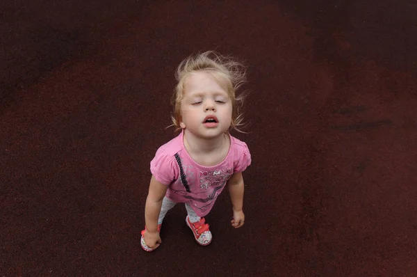 Capricious Little Girl Dark Red Background — Stock Photo, Image