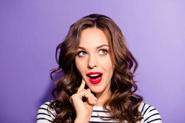 Portrait of funny dreamy girl with vivid bright pomade find idea solution decision  looking up with open mouth guessing answer isolated on violet background