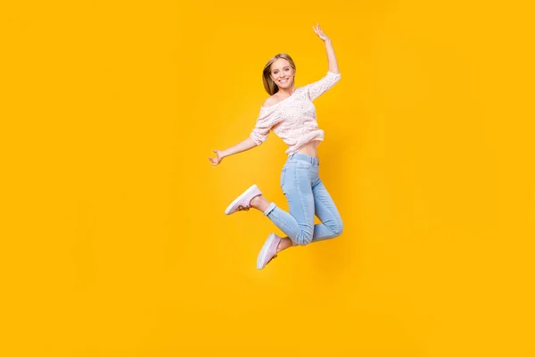 Portrait of playful crazy girl jumping in the air looking at camera enjoying weekend having perfect mood isolated on yellow background — Stock Image Portrait Playful Crazy Girl Jumping Air Looking Camera Enjoying Weekend Royalty Free Stock Photos
