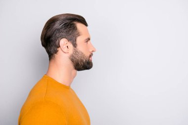 Close up profile side half-faced view portrait of handsome virile attractive serious pensive pondering thoughtful dreamy dreaming with trendy haircut guy isolated on gray background copy-space clipart