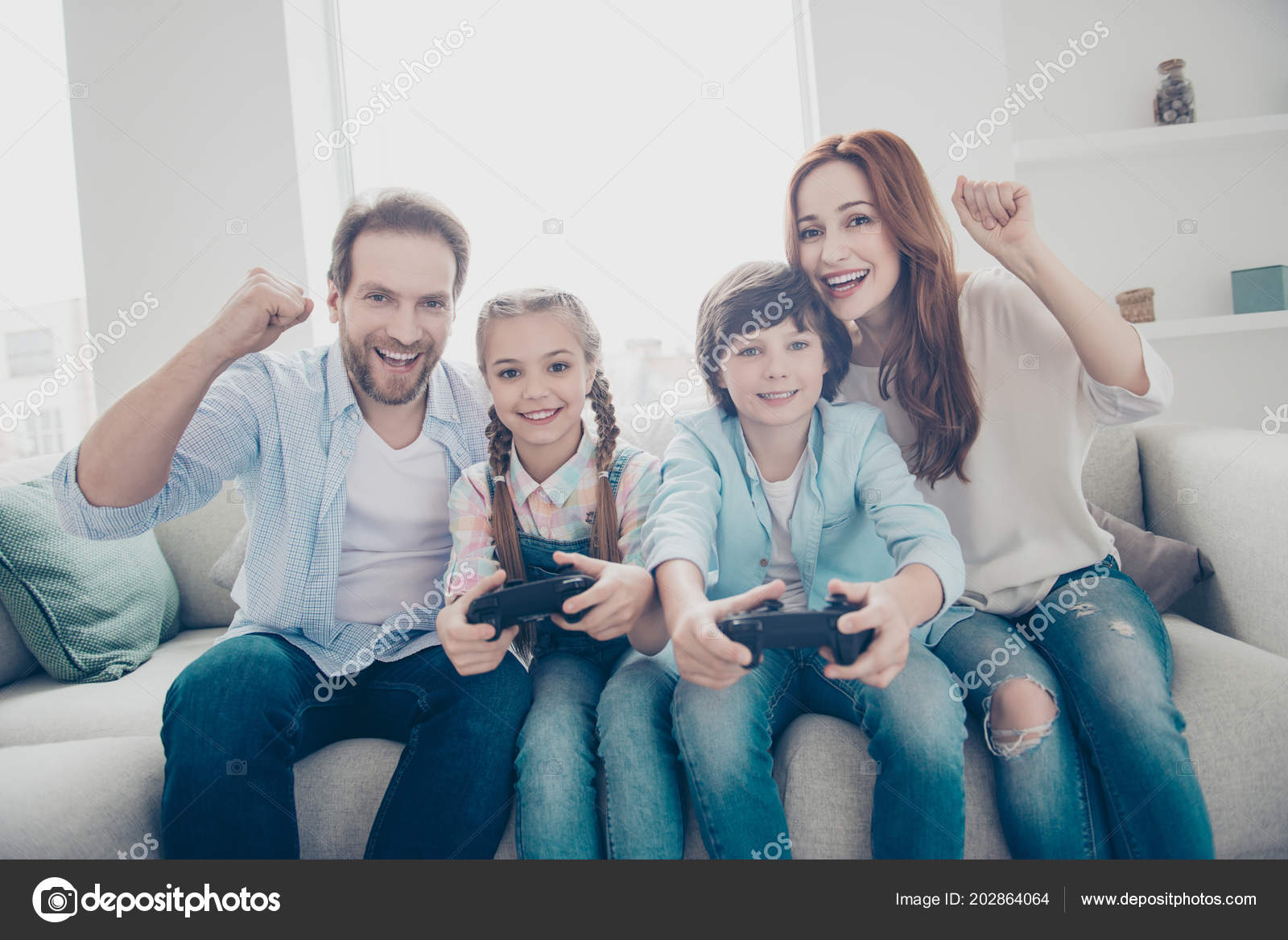 Portrait Cheerful Brother Sister Playing Box Using Console Controller  Active Stock Photo by Â©deagreez1 202864064