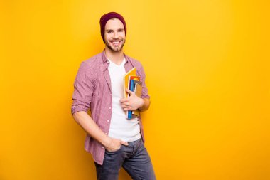 Cool lecture learn career assistant teen age youth people person model fashion concept. Portrait of confident self-assured handsome student carrying book in hands isolated on background copy-space clipart