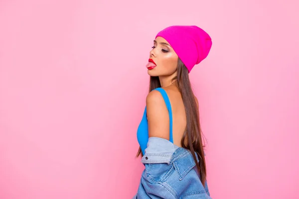 Side profile view photo portrait of attractive confident charming gorgeous lady showing tongue looking down isolated bright vivid pastel background