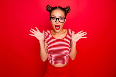 SALE! Portrait of shocked face surprised girl with wide open mouth and eyes in eyewear gesturing with palms near face isolated on red background clipart