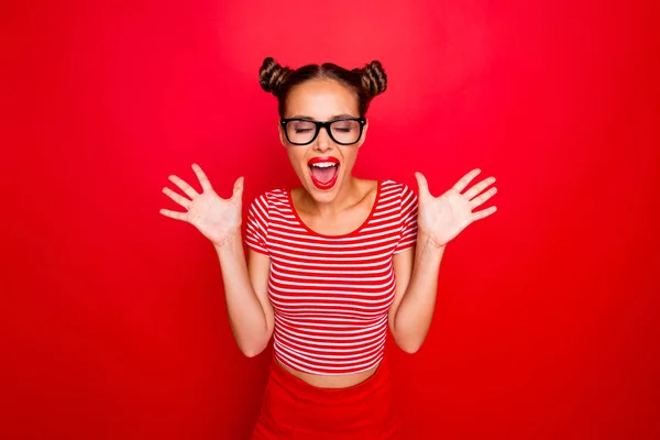 Portrait of screaming happy surprised girl in  eyewear with wide