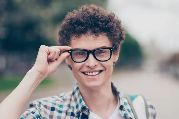 Portrait of curly haired cute attractive handsome smiling guy we — Stock Photo, Image