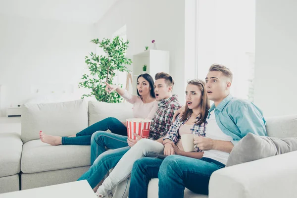 Concept of human reactions. Group hipster  of four guys sit on a — Stock Photo, Image