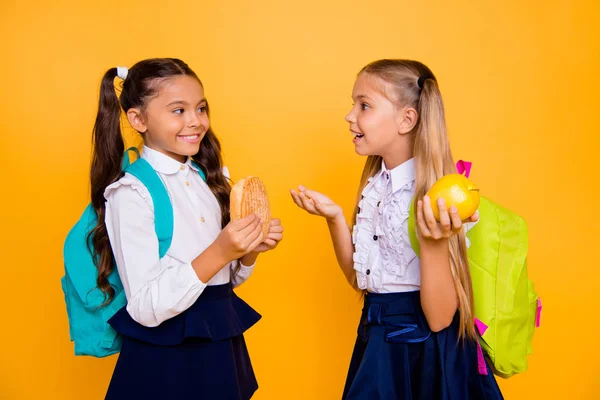 Profile side view photo of two small girls isolated on shine yel — Stock Photo, Image