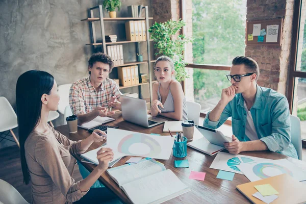 Youth worker girl tutor helps to sort out with homework group of — Stock Photo, Image