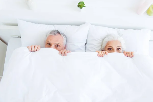 High angle top view surprised funny couple gray hair people in p