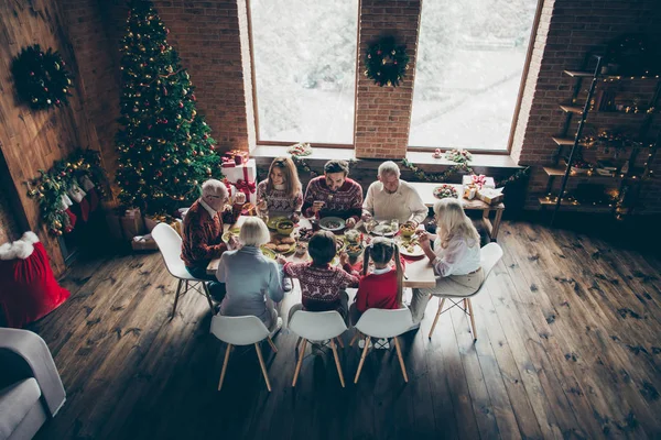 Above top high angle view of noel evening family gathering in lo