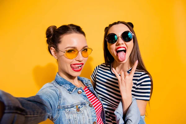 Carefree careless funny glad two girlish lady isolated on yellow — Stock Photo, Image